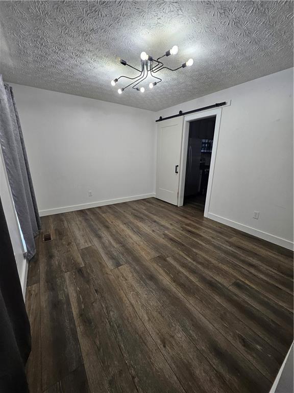 291 Sterling Trail Powder Springs, GA 30127 - Photo 15 of 43 en empty room with wooden floor