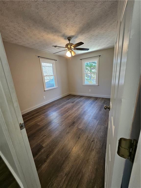 291 Sterling Trail Powder Springs, GA 30127 - Photo 19 of 43 wooden floor in an empty room with a window