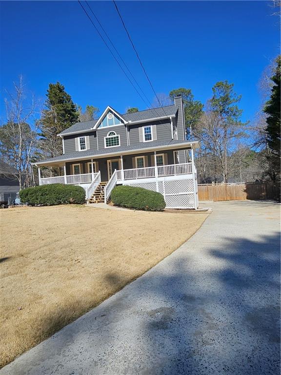 291 Sterling Trail Powder Springs, GA 30127 - Photo 2 of 43 a front view of a house with a yard