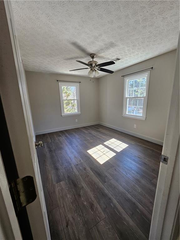 291 Sterling Trail Powder Springs, GA 30127 - Photo 21 of 43 wooden floor in an empty room with a window