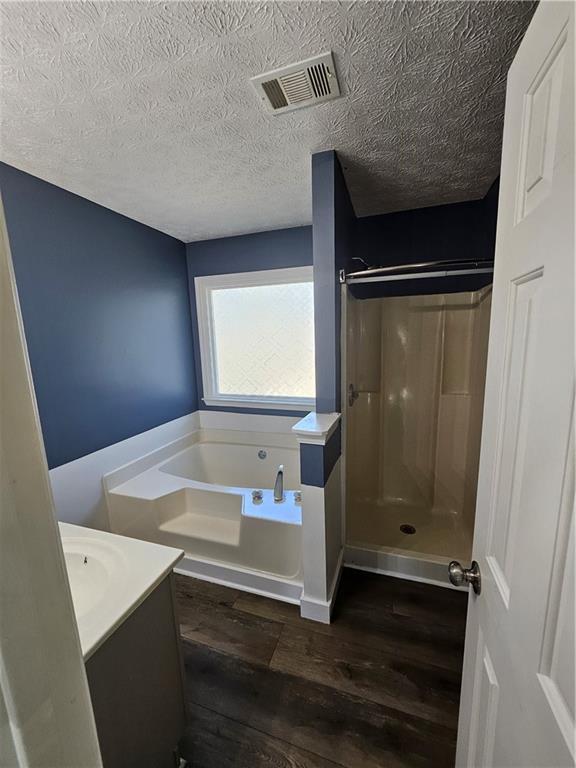 291 Sterling Trail Powder Springs, GA 30127 - Photo 28 of 43 a bathroom with a sink a mirror and a bathtub