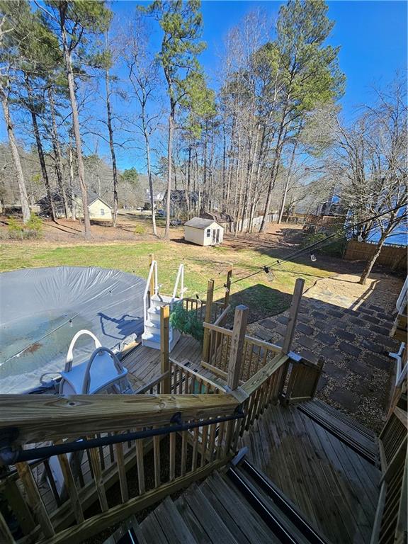 291 Sterling Trail Powder Springs, GA 30127 - Photo 42 of 43 a view of a swimming pool with a patio