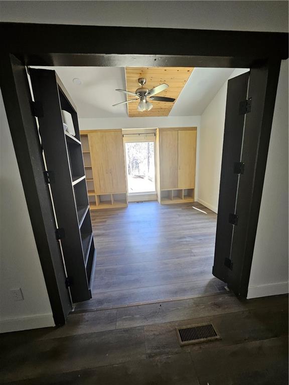 291 Sterling Trail Powder Springs, GA 30127 - Photo 8 of 43 a view of a hallway with wooden floor and stairs