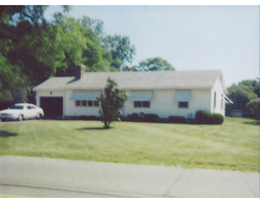 942 Florence Road Northampton, MA 01062 - Photo 1 of 1 a front view of a house with a yard and garage