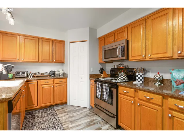 a kitchen with a sink cabinets and window