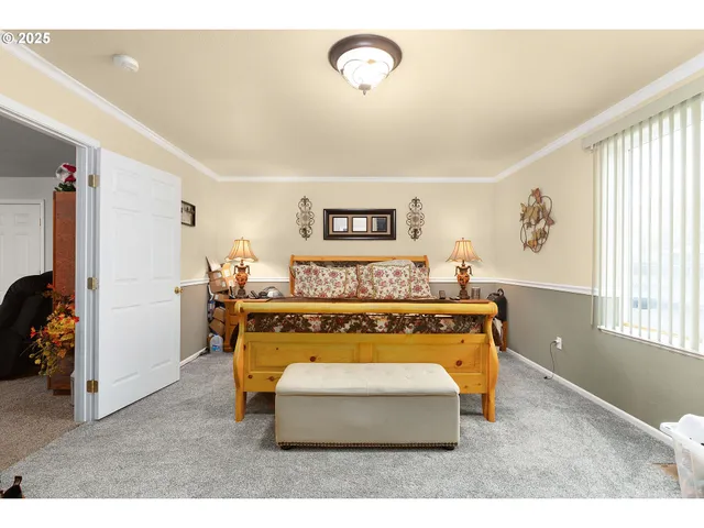 a bedroom with furniture and a window