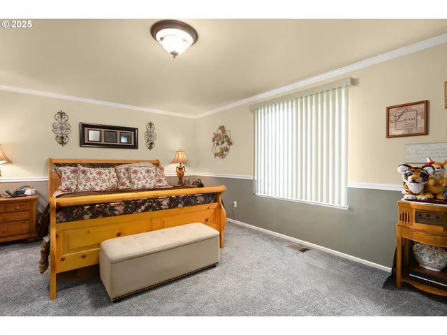 a bedroom with a bed and a television in it