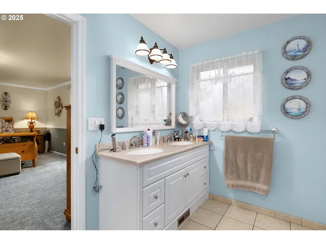 a bathroom with a sink and mirror