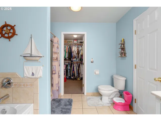 a bedroom with a bed and a bookshelf