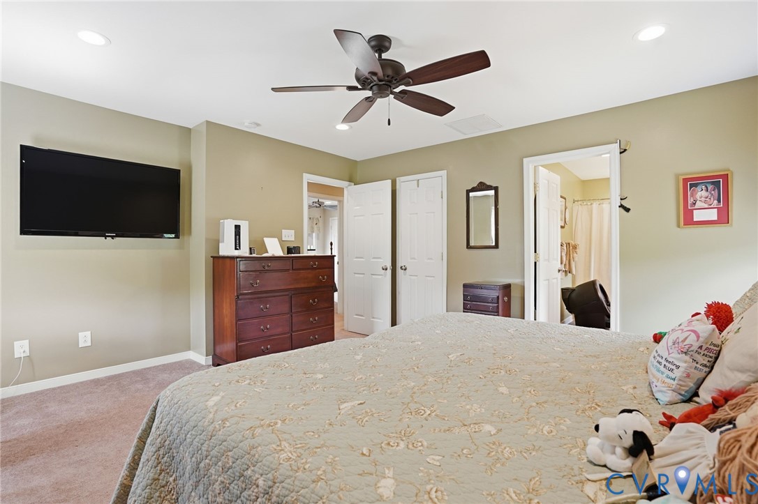19012 Teman Road Beaverdam, VA 23015 - Photo 21 of 41 a bedroom with a bed and a flat screen tv