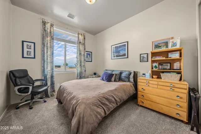 a bedroom with a bed and a closet