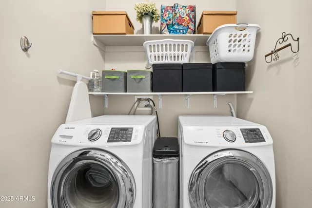 a view of a utility room with dryer and washer