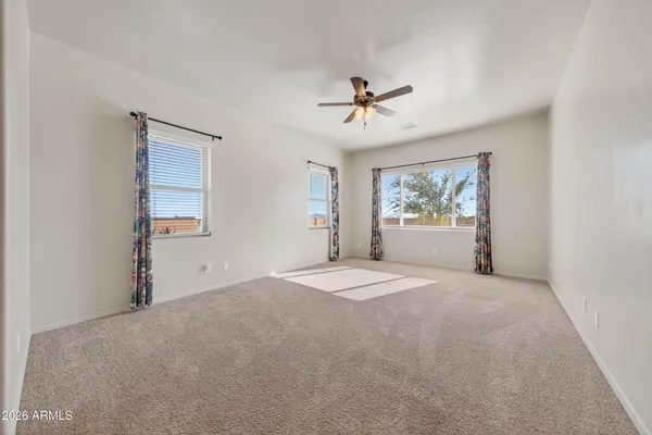 a big room with closet and windows