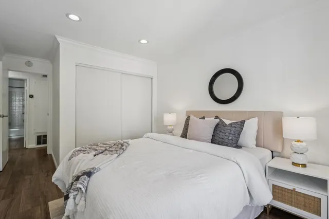 a bedroom with a bed and a closet