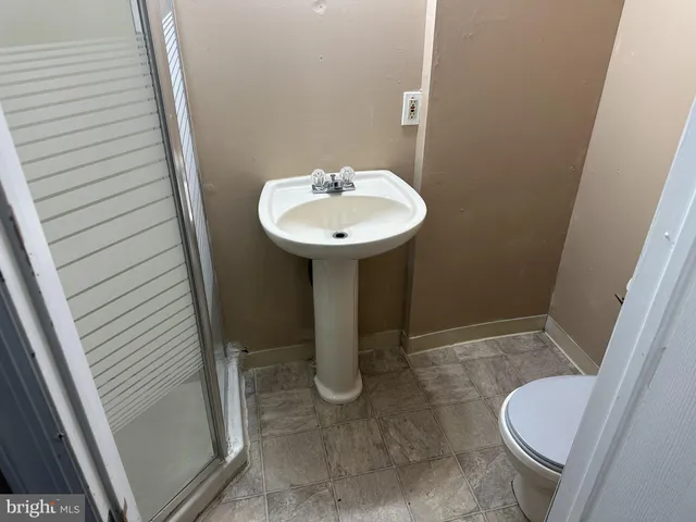 a bathroom with a sink and toilet