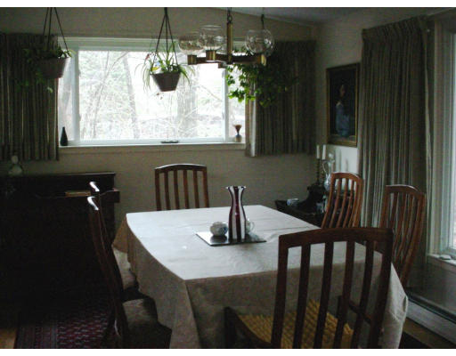 58 Turning Mill Road Lexington, MA 02420 - Photo 3 of 8 a kitchen with a table chairs and window