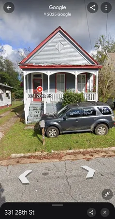 a front view of a house with garden