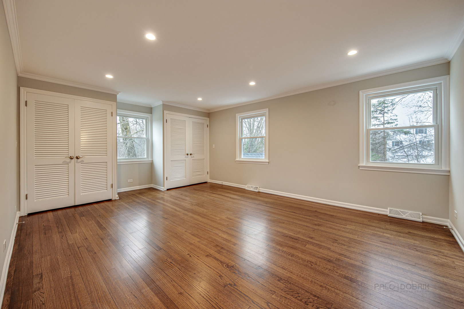 1750 Meadow Lane Bannockburn, IL 60015 - Photo 13 of 19 an empty room with wooden floor and windows