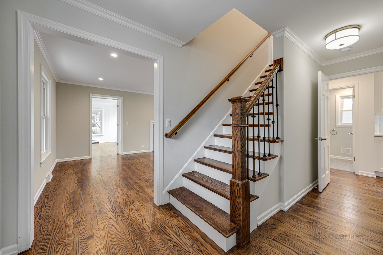 1750 Meadow Lane Bannockburn, IL 60015 - Photo 2 of 19 a view of a hallway with wooden floor and stairs