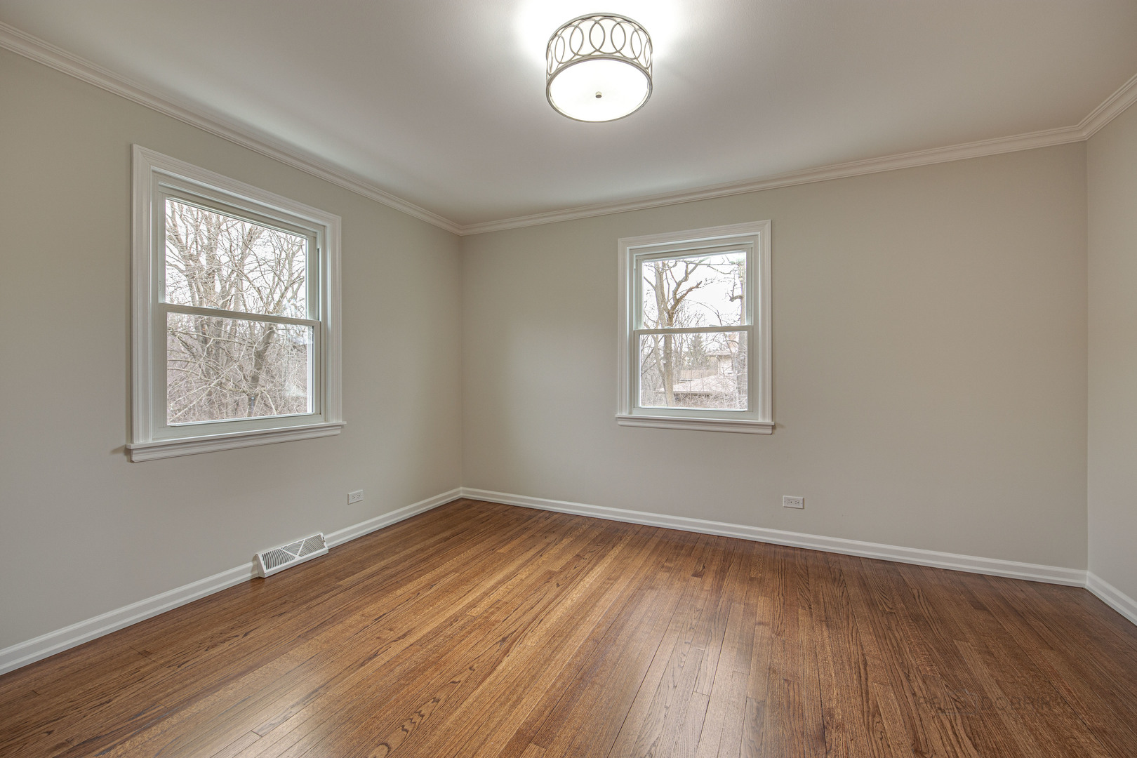 1750 Meadow Lane Bannockburn, IL 60015 - Photo 10 of 19 a view of empty room with wooden floor and fan