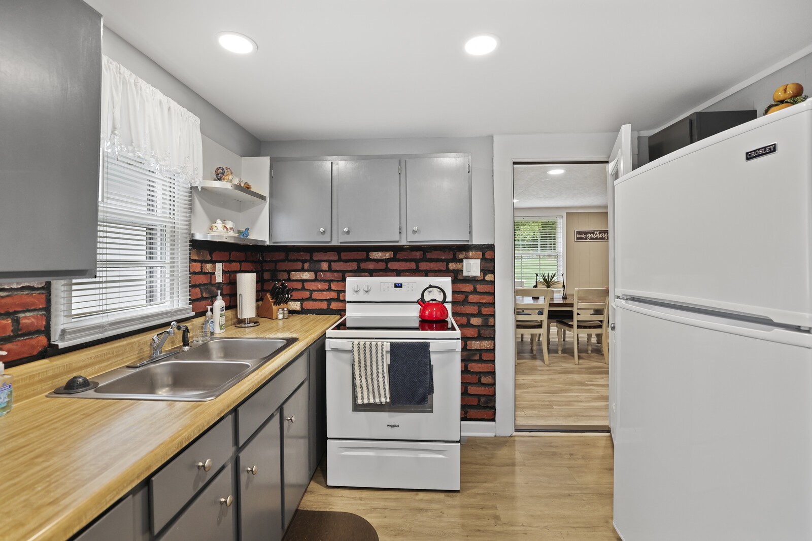 233 Rucker Road Murfreesboro, TN 37127 - Photo 17 of 55 a kitchen with stainless steel appliances granite countertop a sink stove and refrigerator