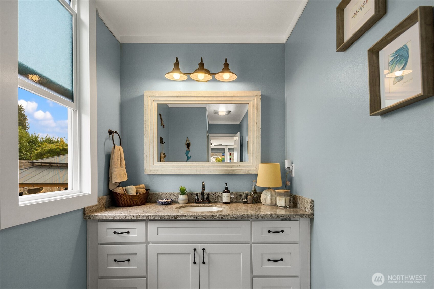 1002 Thompson Street Sumner, WA 98390 - Photo 12 of 38 a bathroom with a sink and a mirror