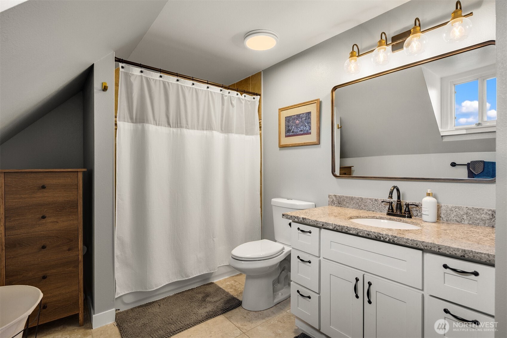 1002 Thompson Street Sumner, WA 98390 - Photo 19 of 38 a bathroom with a granite countertop sink toilet and mirror