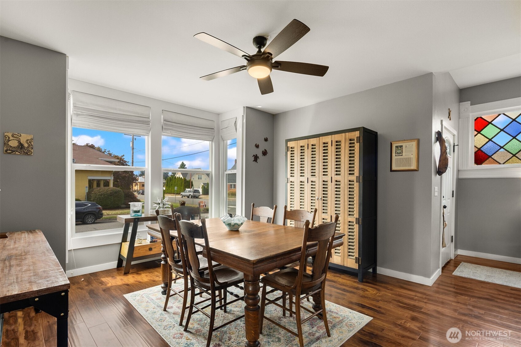 1002 Thompson Street Sumner, WA 98390 - Photo 27 of 38 a view of a dining room with furniture window and wooden floor