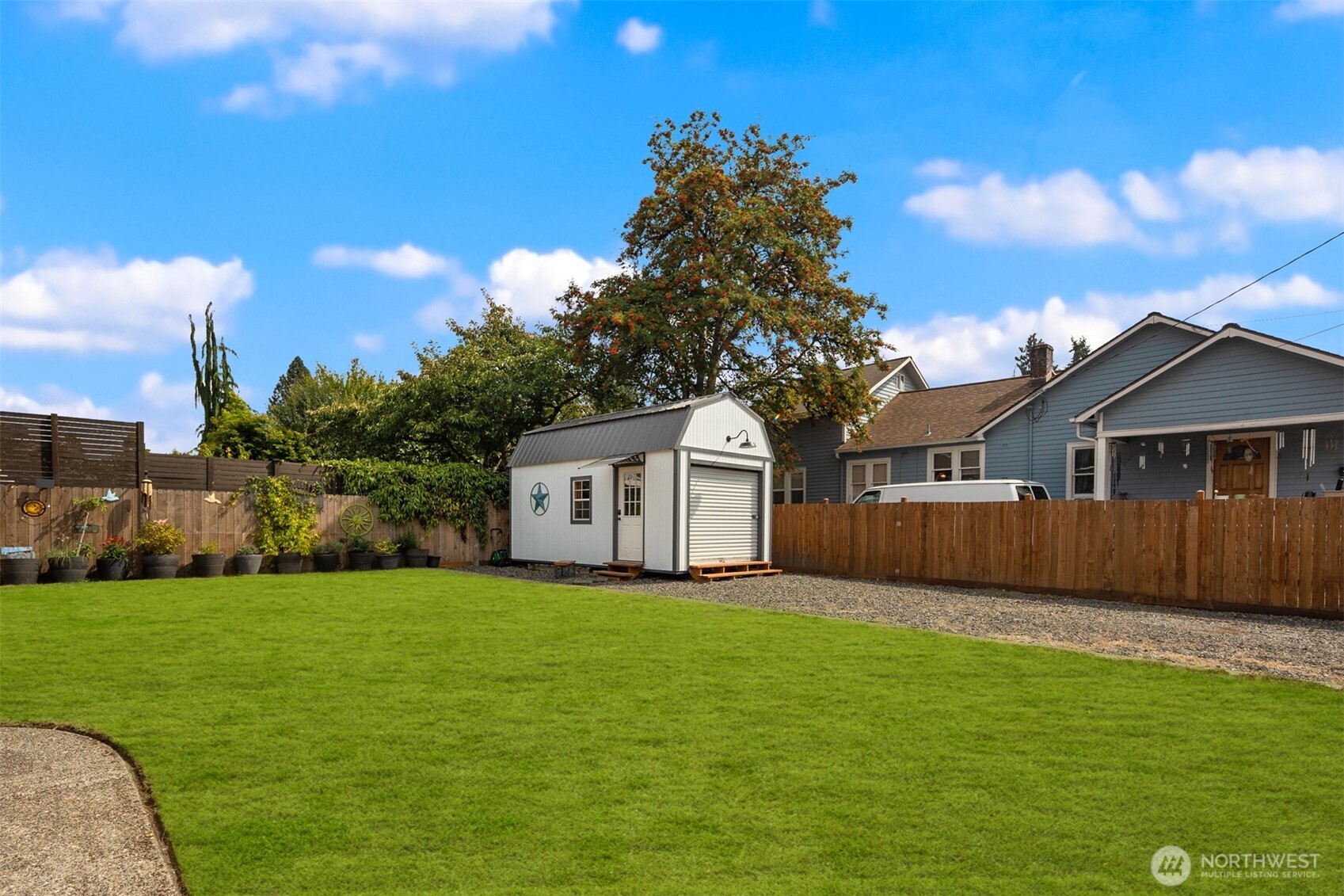 1002 Thompson Street Sumner, WA 98390 - Photo 30 of 38 a view of a yard in front of a house