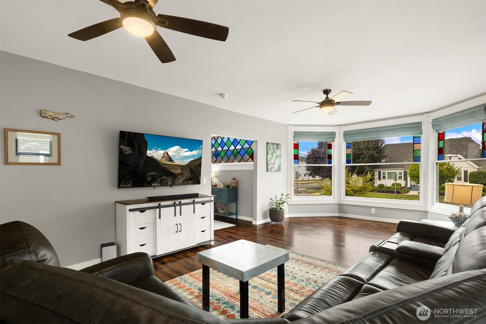 1002 Thompson Street Sumner, WA 98390 - Photo 3 of 38 a living room with furniture and a wooden floor