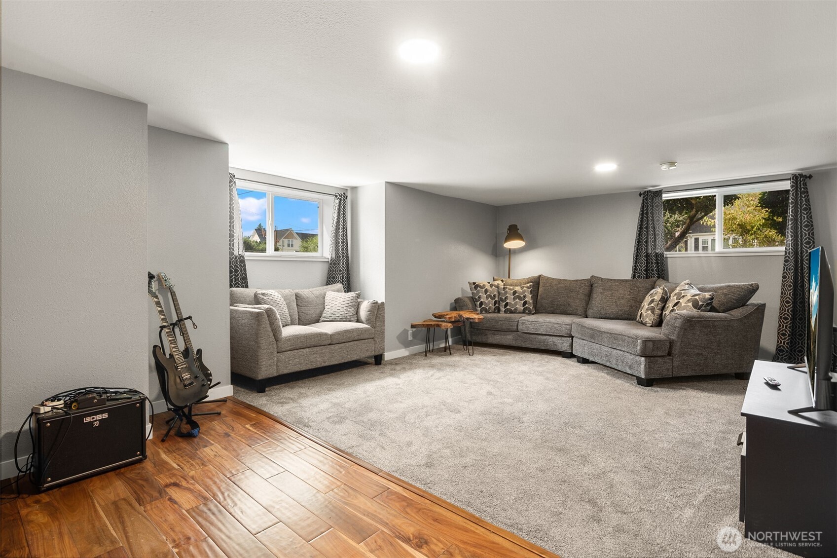 1002 Thompson Street Sumner, WA 98390 - Photo 33 of 38 a living room with furniture and a wooden floor