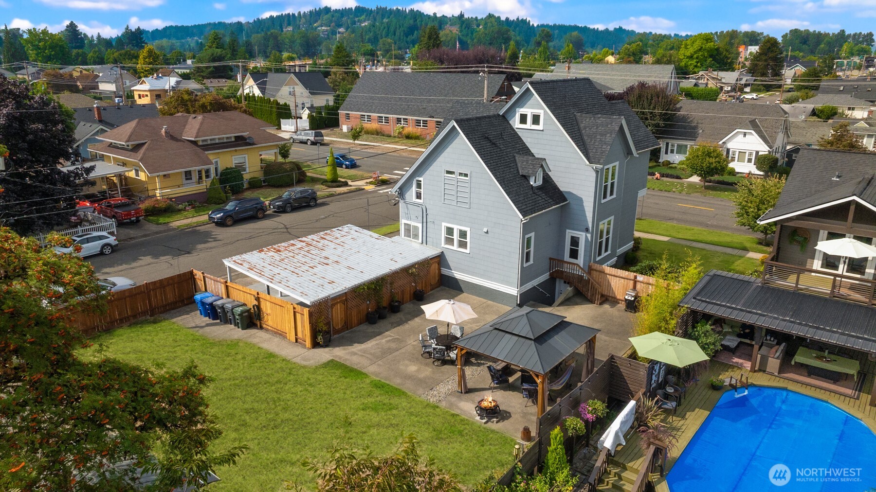 1002 Thompson Street Sumner, WA 98390 - Photo 36 of 38 an aerial view of a house with swimming pool and outdoor seating
