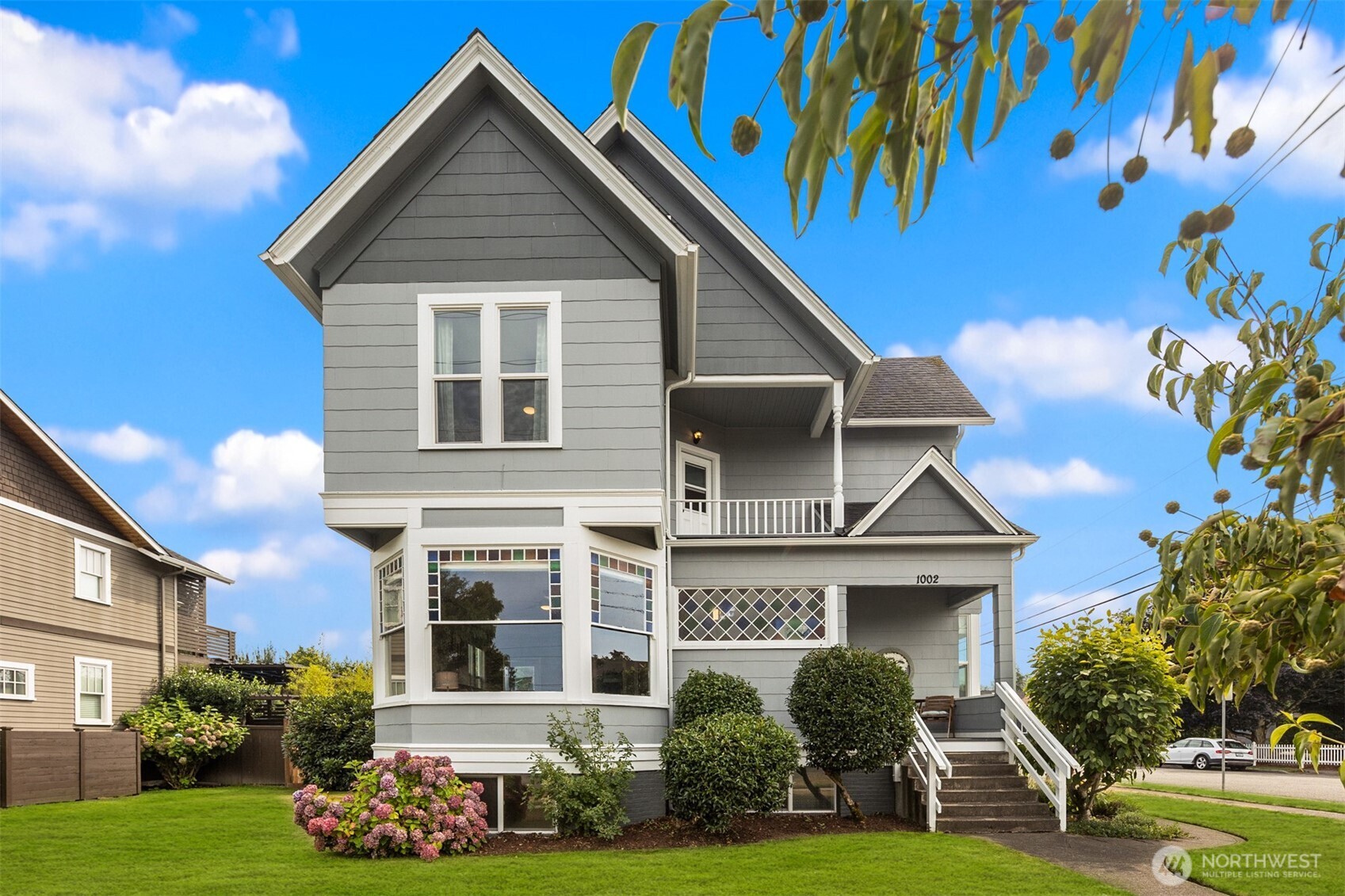 1002 Thompson Street Sumner, WA 98390 - Photo 38 of 38 a front view of a house with a yard