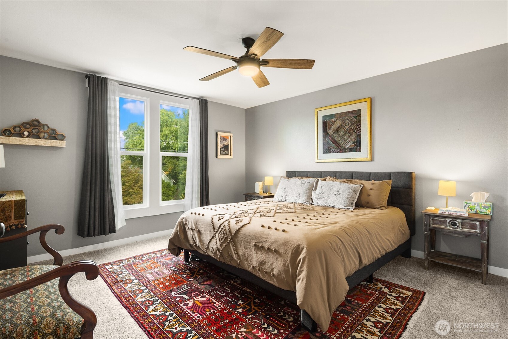 1002 Thompson Street Sumner, WA 98390 - Photo 6 of 38 a bedroom with a bed and a chandelier