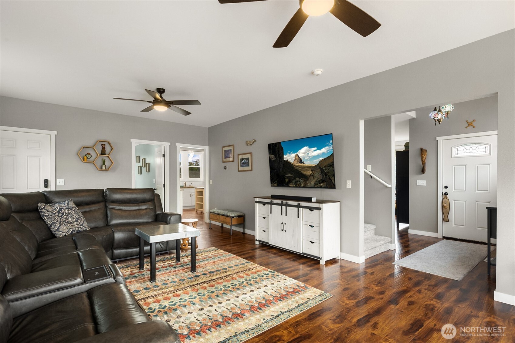 1002 Thompson Street Sumner, WA 98390 - Photo 10 of 38 a living room with furniture and a flat screen tv