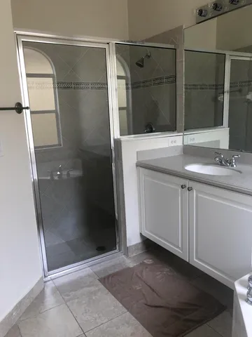 a bathroom with a sink and a window