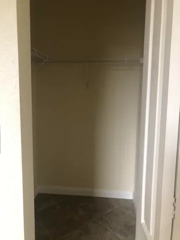 a view of a hallway with closet area