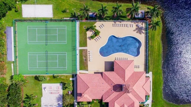 a green field with tree in the background