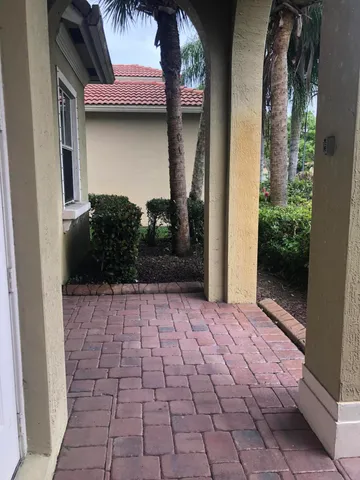 a view of a pathway both side of house
