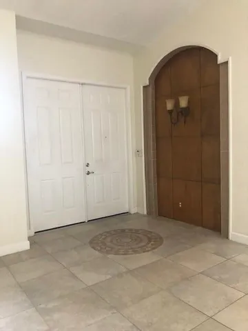 an empty room with closet area