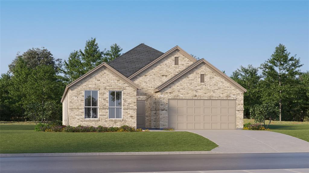 Craftsman inspired home featuring a garage and a front lawn