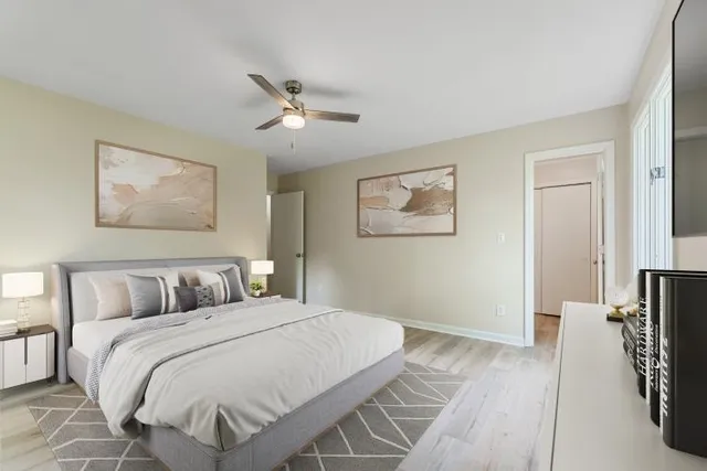 a bathroom with a tub shower vanity and a sink