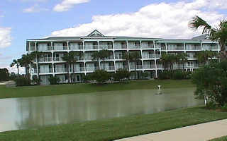 207 Gulf Place, Unit 207 Santa Rosa Beach, FL 32459 - Photo 1 of 1 a front view of a house with a garden