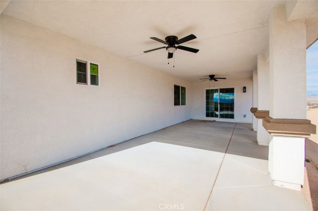 16925 Nanticoke Road Apple Valley, CA 92307 - Photo 13 of 42 a view of a livingroom with a ceiling fan and window