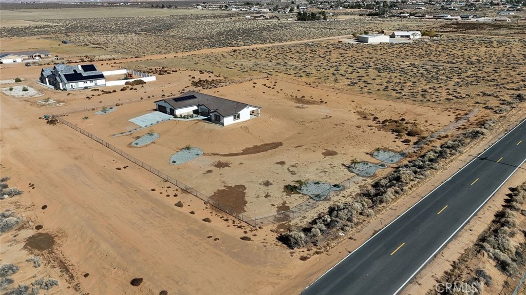 16925 Nanticoke Road Apple Valley, CA 92307 - Photo 17 of 42 a vase of flowers sitting on a floor