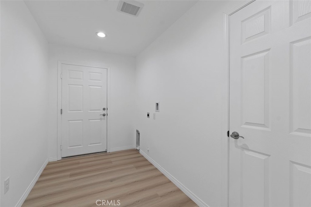 16925 Nanticoke Road Apple Valley, CA 92307 - Photo 23 of 42 a view of a room with wooden floor