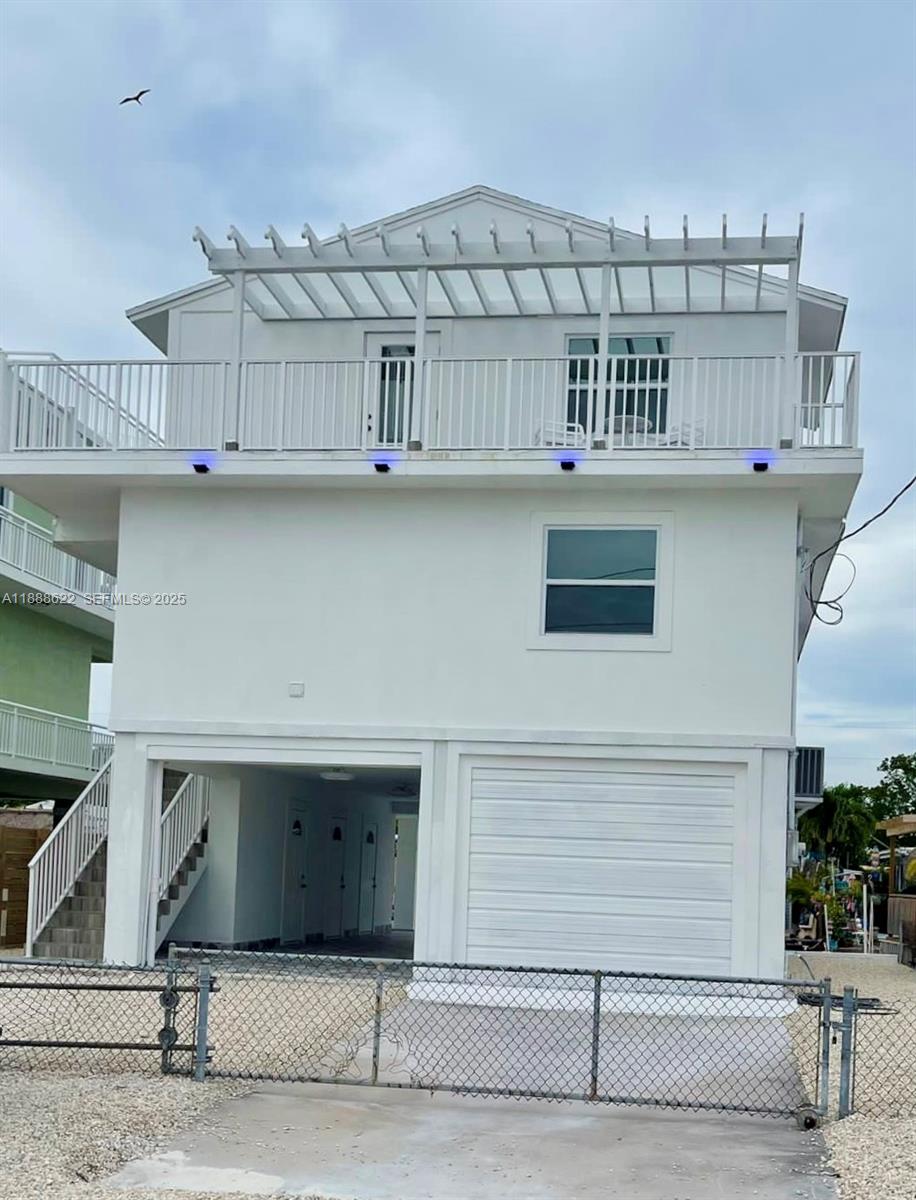 a view of a balcony with a potted plant
