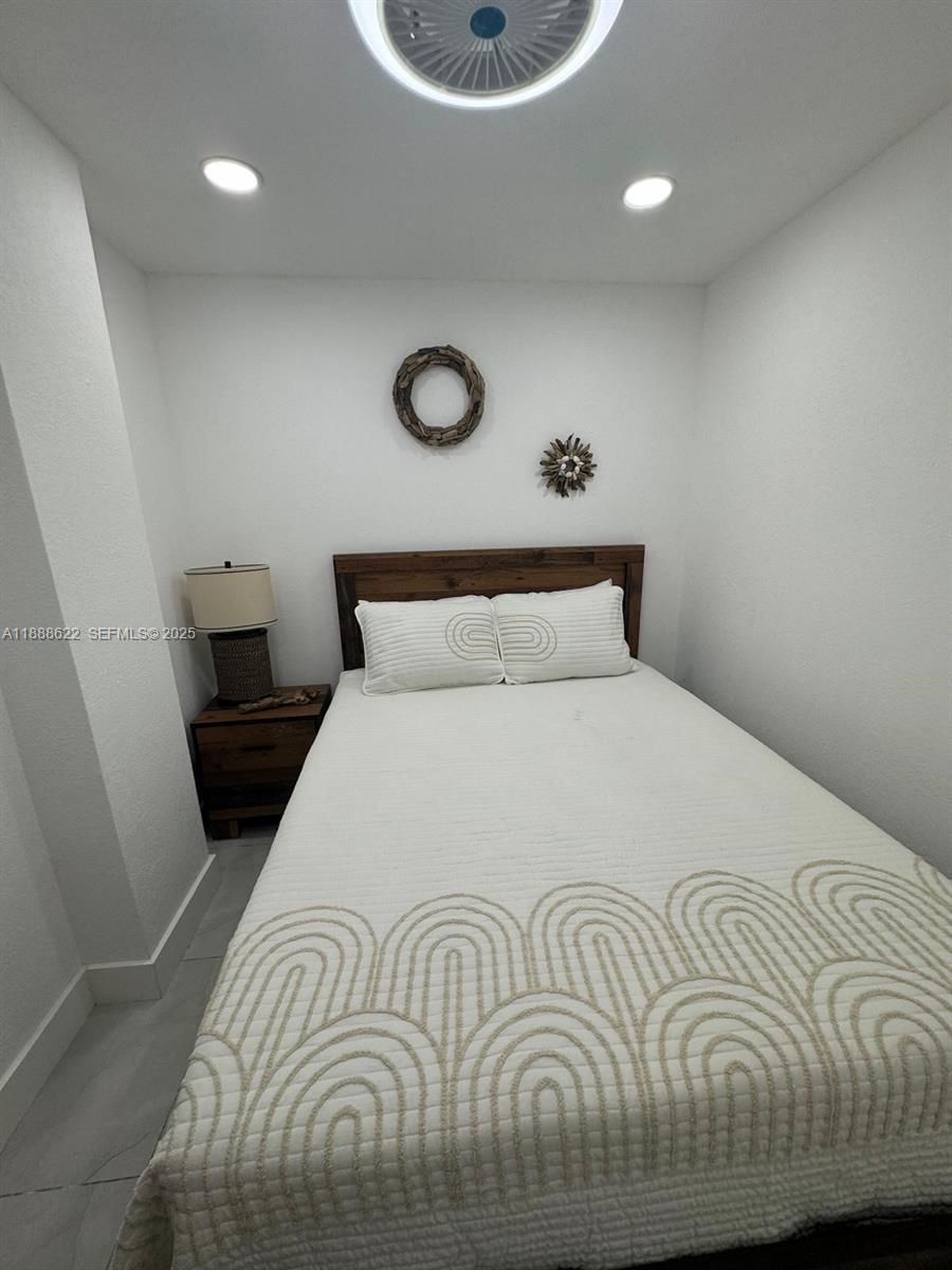 20 Eagle Drive Key Largo, FL 33037 - Photo 26 of 55 a bedroom with a bed and a window