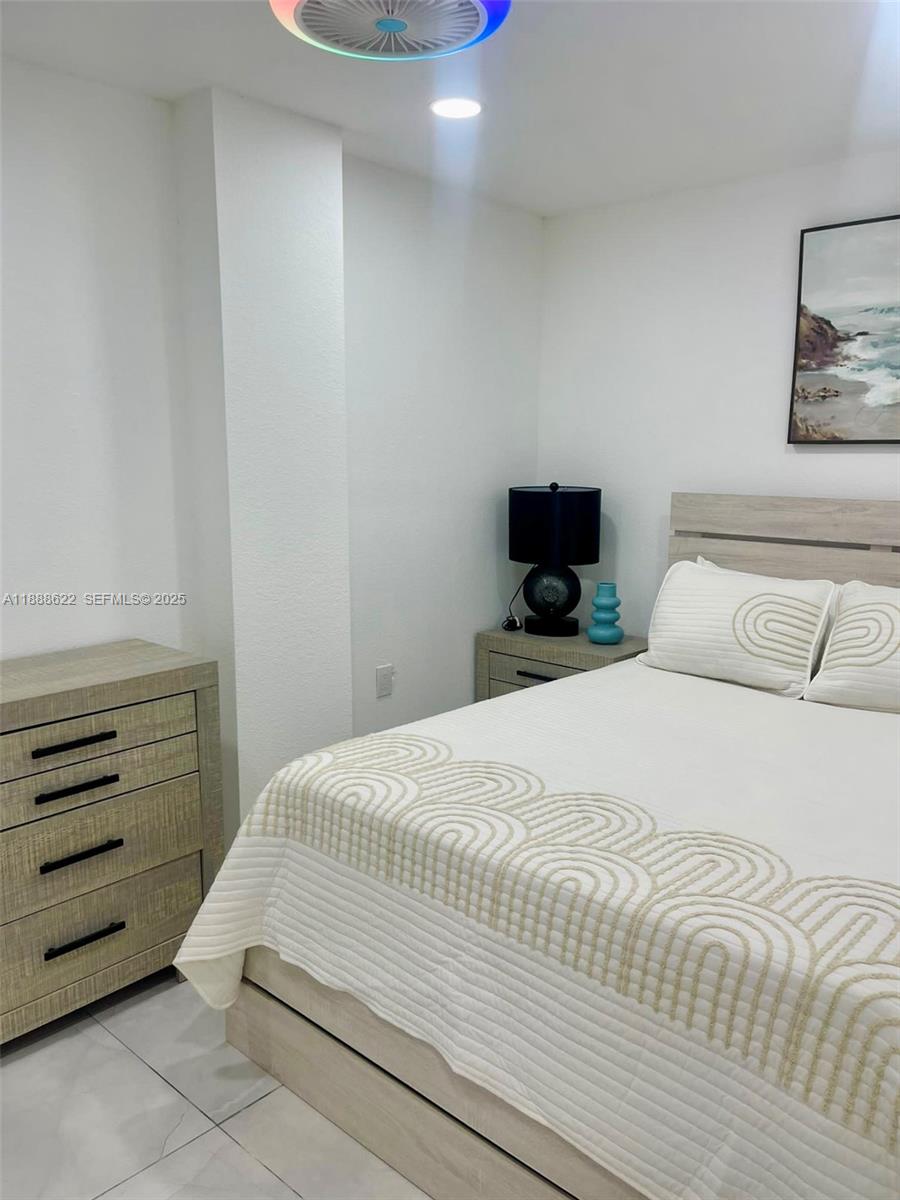 20 Eagle Drive Key Largo, FL 33037 - Photo 29 of 55 a bedroom with a bed and a tv