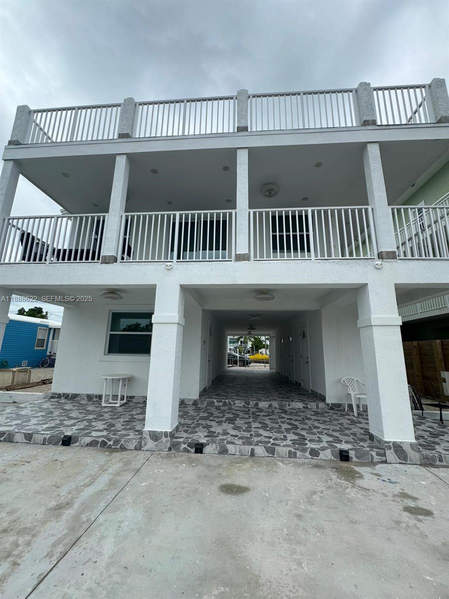 20 Eagle Drive Key Largo, FL 33037 - Photo 3 of 55 a view of a house with a balcony